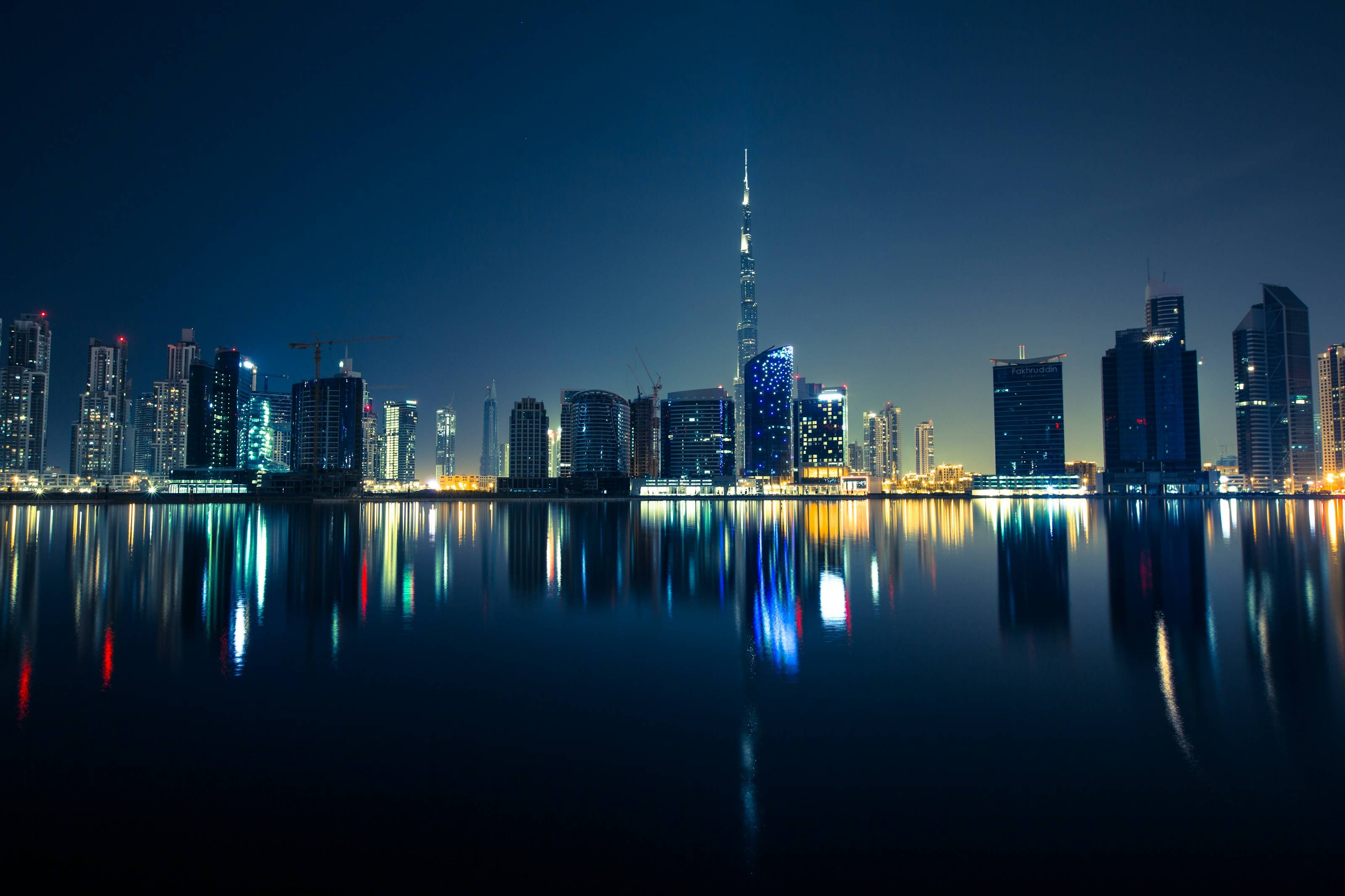 The Dubai skyline across the water at dusk
