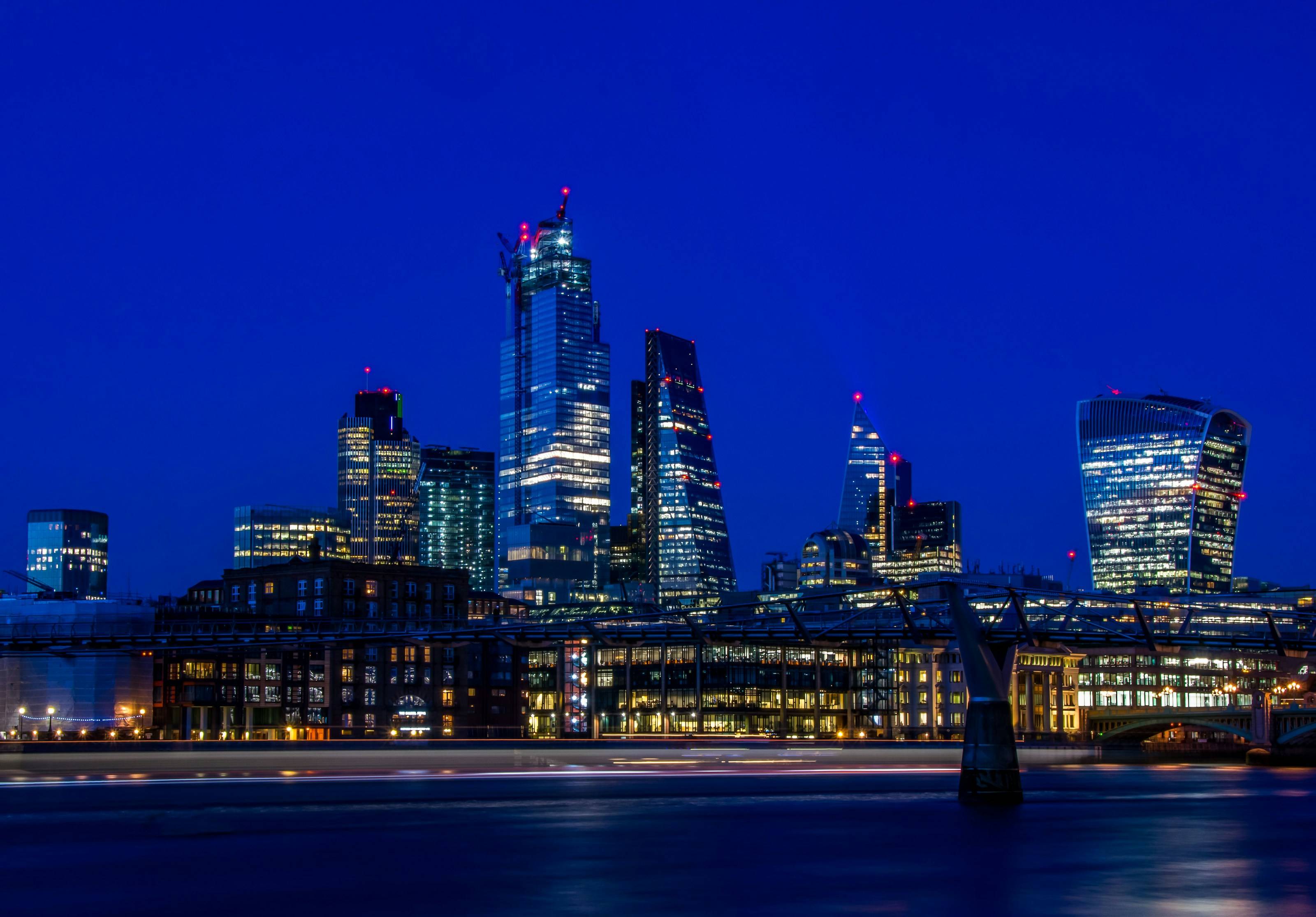 The City of London skyline across the Thames at dusk